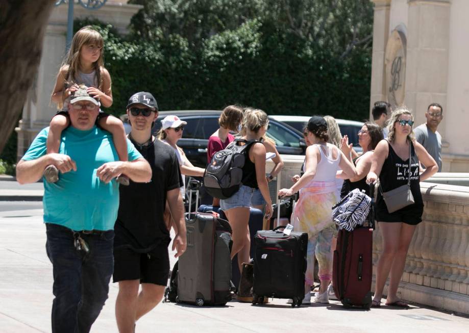 Tourists gather at the Bellagio fountain on Sunday, June 7, 2020, in Las Vegas. On Sunday, both ...