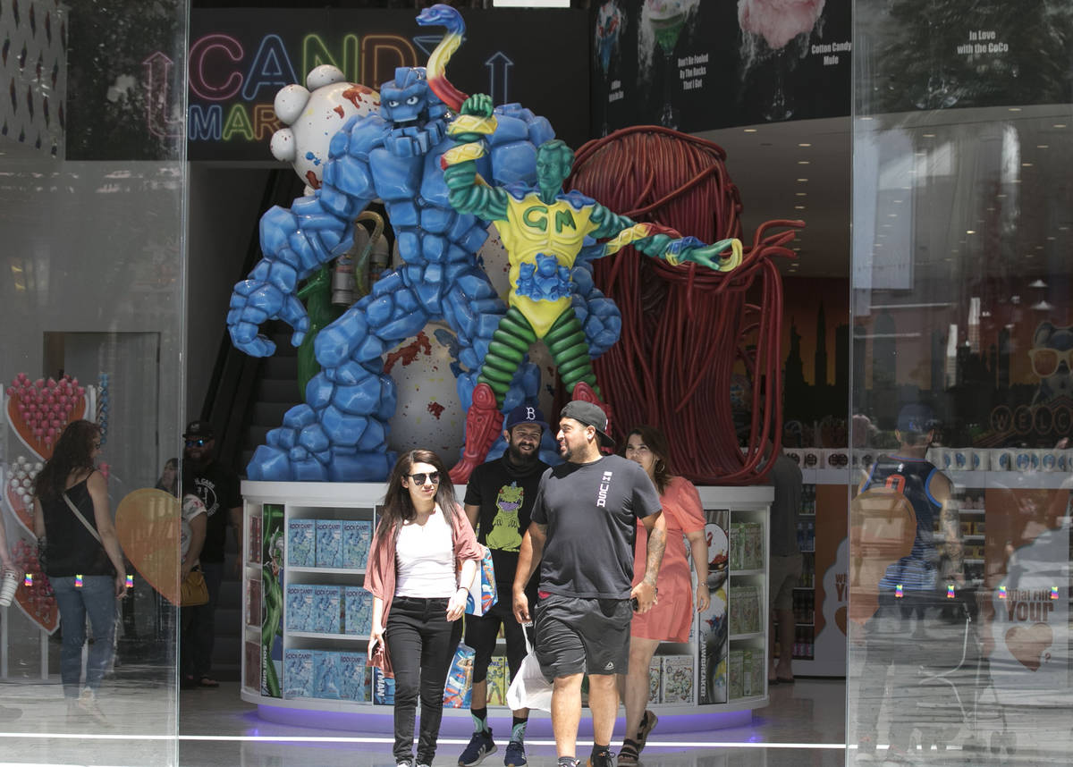 People leave I Love Sugar store at The Line Promenade on Sunday, June 7, 2020, in Las Vegas. ...