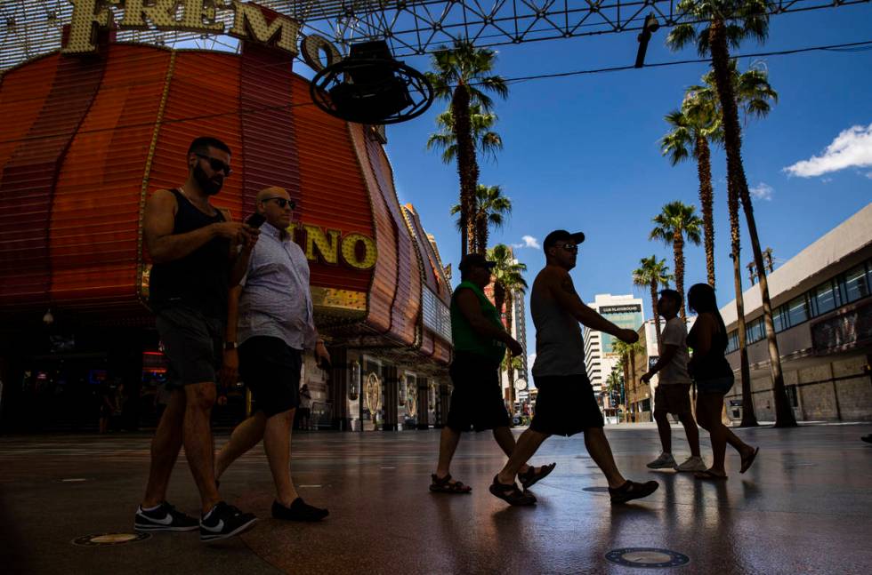 People walk around the Fremont Street Experience in downtown Las Vegas on Saturday, June 6, 202 ...