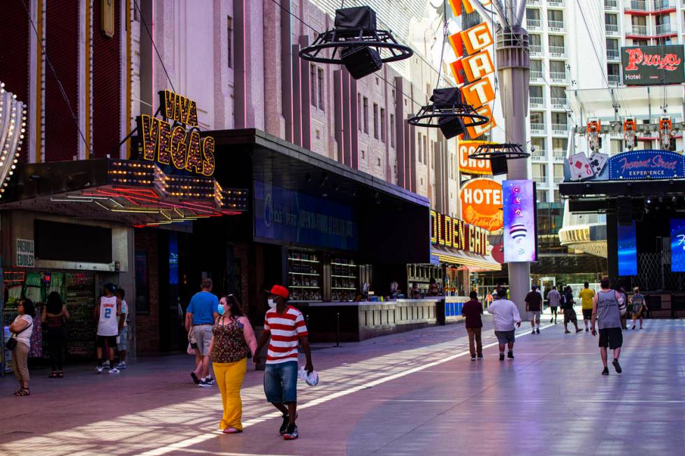 People walk around the Fremont Street Experience in downtown Las Vegas on Saturday, June 6, 202 ...