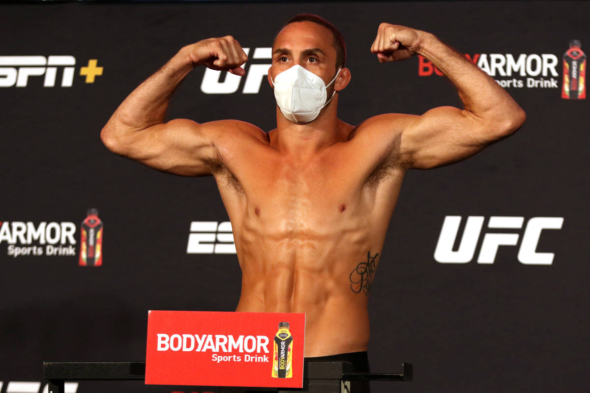 UFC welterweight Anthony Rocco Martin poses on the scale at the UFC Apex after making weight fo ...