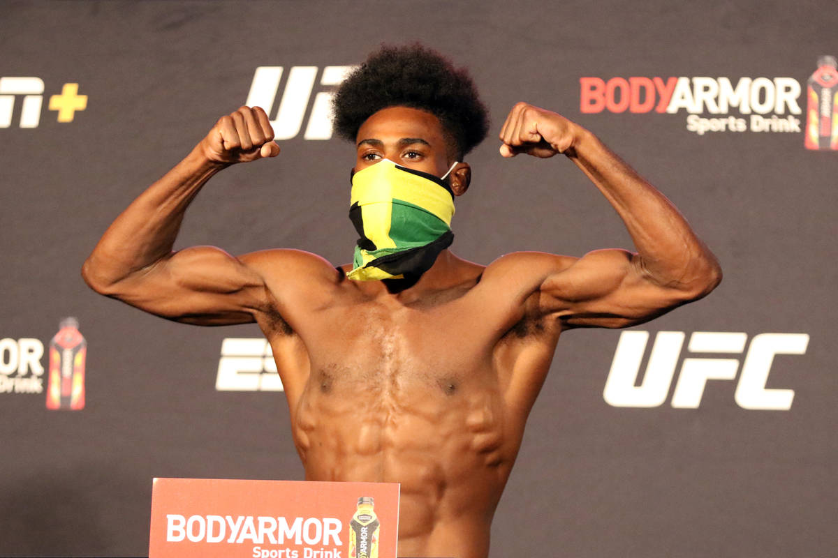 UFC bantamweight Aljamain Sterling poses on the scale at the UFC Apex after making weight for U ...