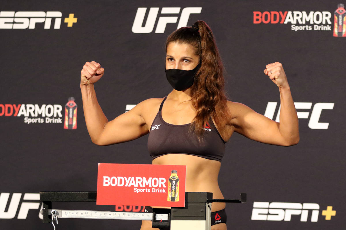 UFC featherweight Felicia Spencer poses on the scale at the UFC Apex after making weight for UF ...