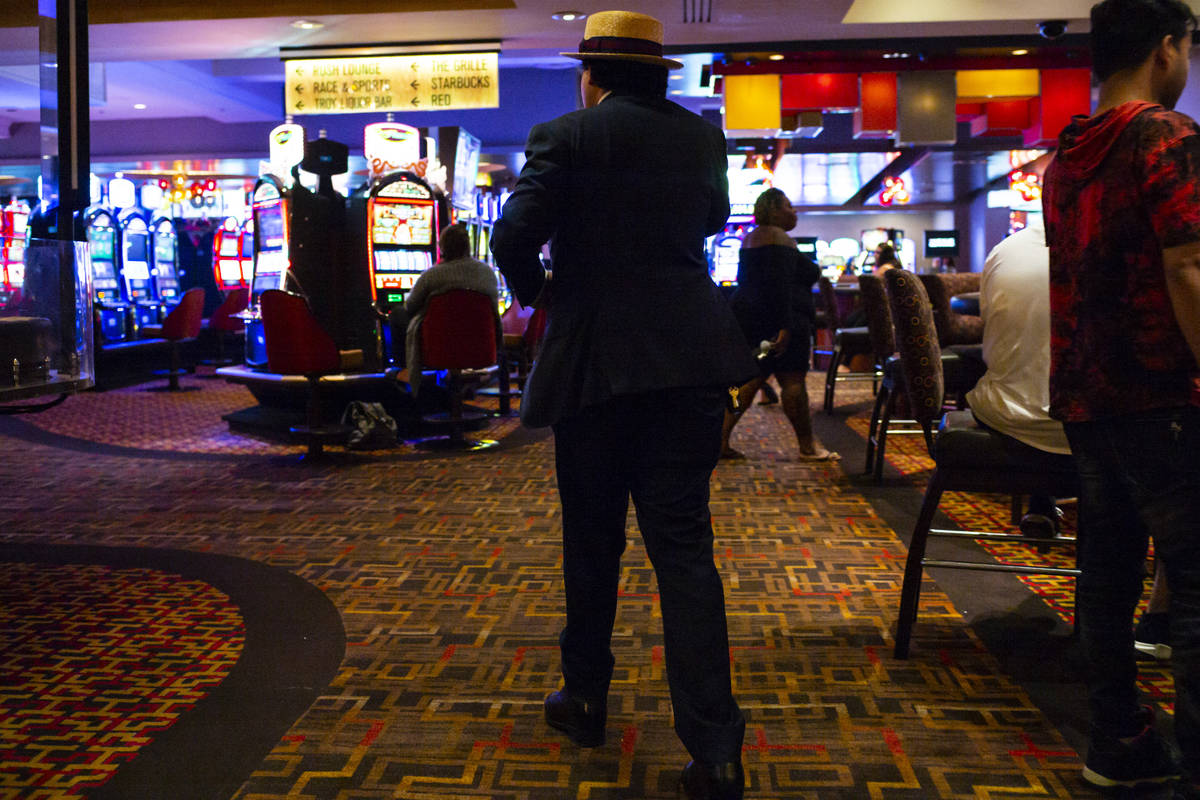 A man walks through the Golden Nugget just before 3 a.m. as hotel-casinos reopen in downtown La ...