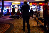 A man walks through the Golden Nugget just before 3 a.m. as hotel-casinos reopen in downtown La ...
