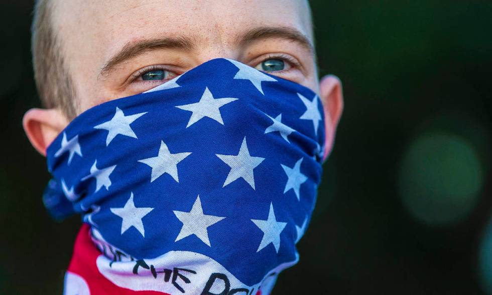 Micheal Howll listens to a speaker during a press conference hosted by Organizing the State Out ...