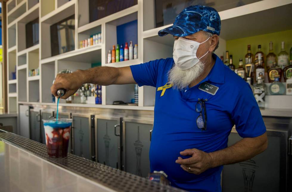 Bartender Rob Lopez makes another drink about the pool at The Strat on Saturday, June 6, 2020 i ...