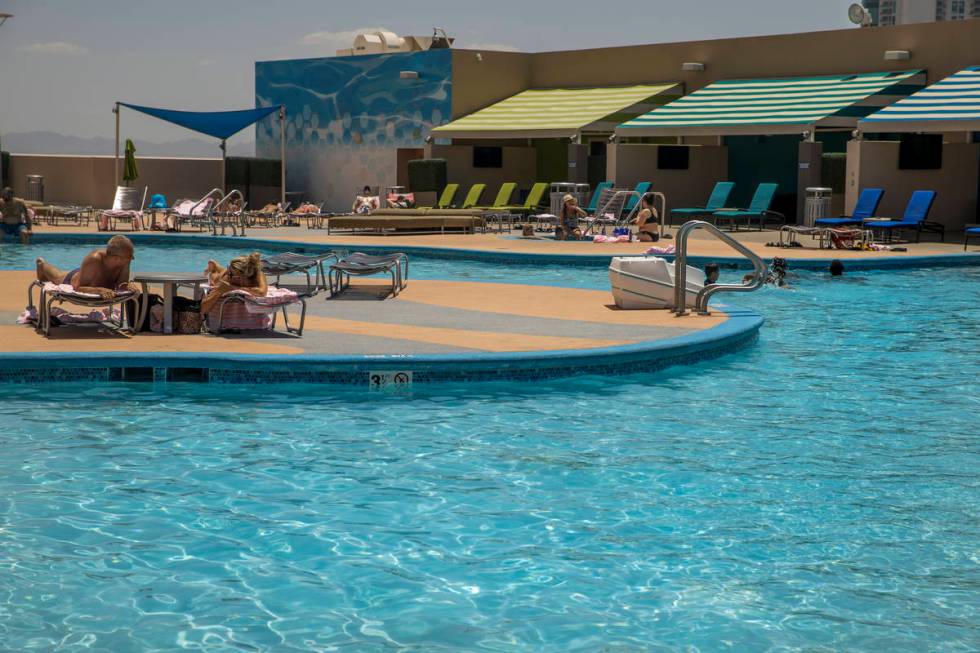 Guests enjoy the nice, cool waters of the pool at The Strat on Saturday, June 6, 2020 in Las Ve ...