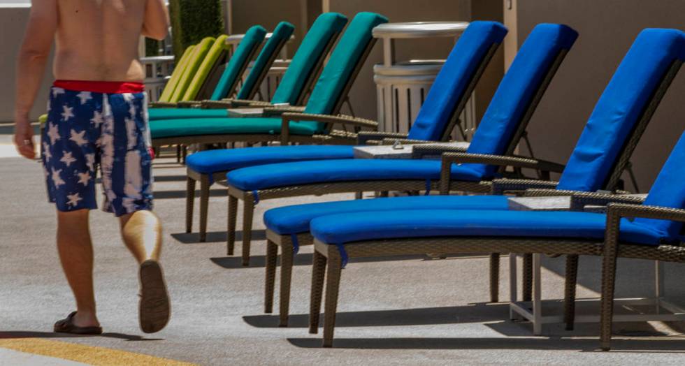 The colorful lounge chairs are set out for guests about the pool at The Strat on Saturday, June ...