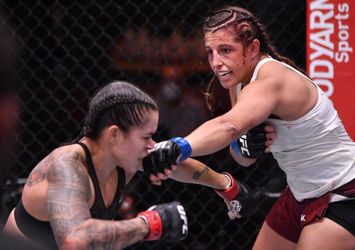 LAS VEGAS, NEVADA - JUNE 06: (R-L) Felicia Spencer of Canada punches Amanda Nunes of Brazil in ...