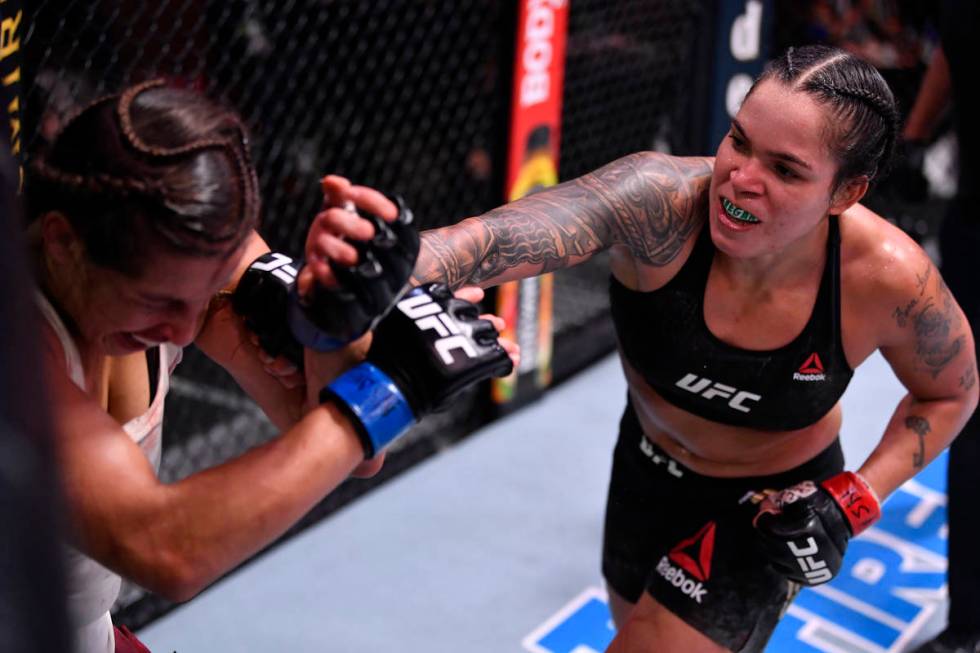 LAS VEGAS, NEVADA - JUNE 06: (R-L) Amanda Nunes of Brazil punches Felicia Spencer of Canada in ...