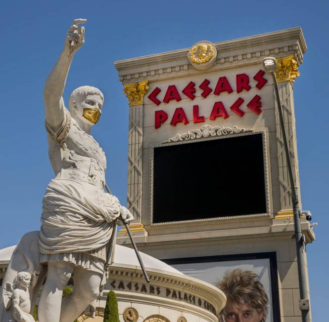 Caesar welcomes all out front while wearing a golden face mask following re-opening ceremonies ...