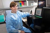 Paul Hartley, director of the Nevada Genomics Center at the University of Nevada, Reno, complet ...