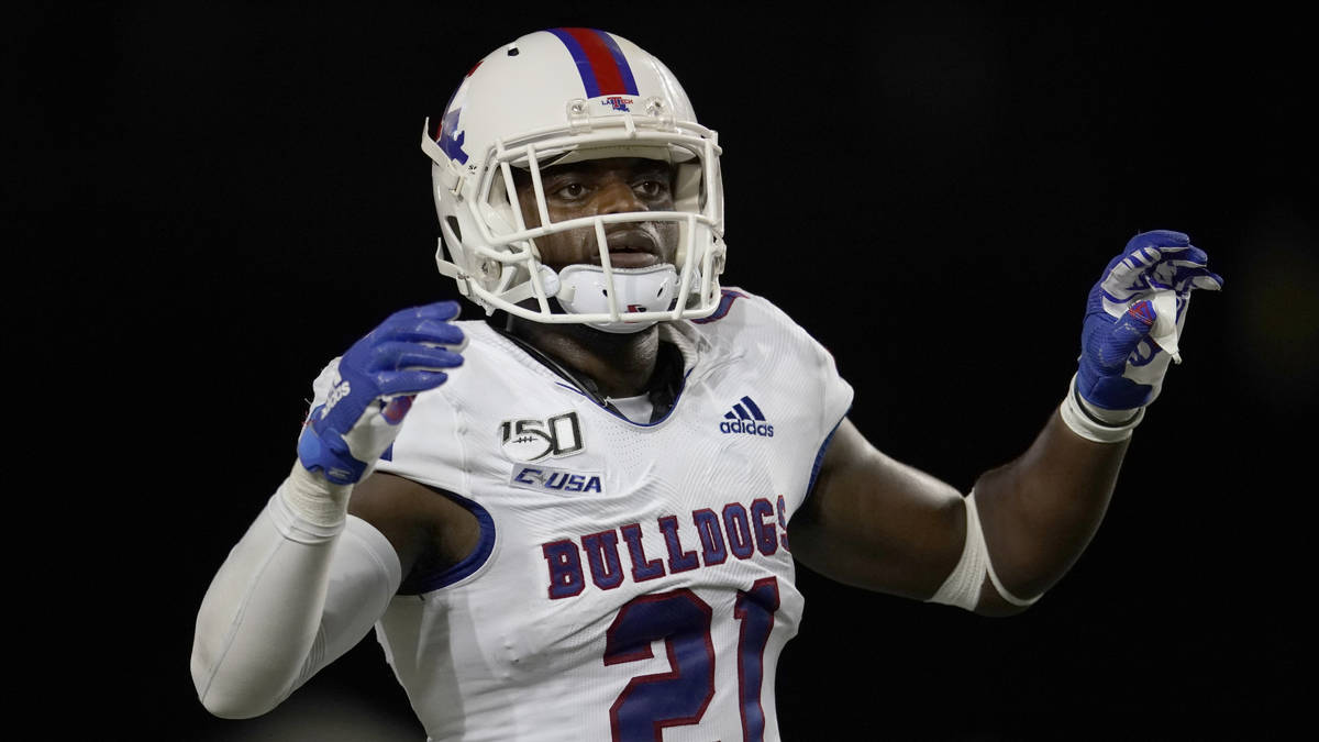 Louisiana Tech's Amik Robertson (21) defends against Texas during the second half of an NCAA co ...