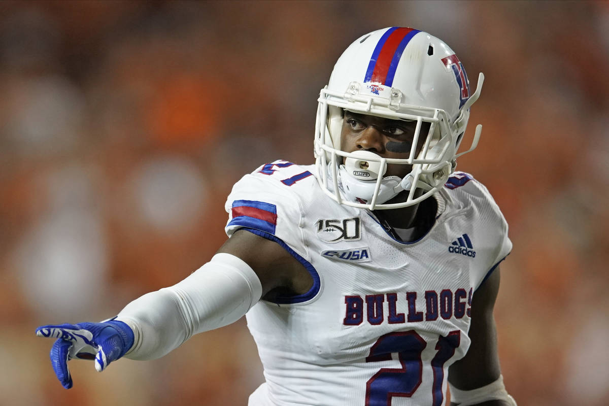 Louisiana Tech's Amik Robertson (21) signals against Texas during the second half of an NCAA co ...