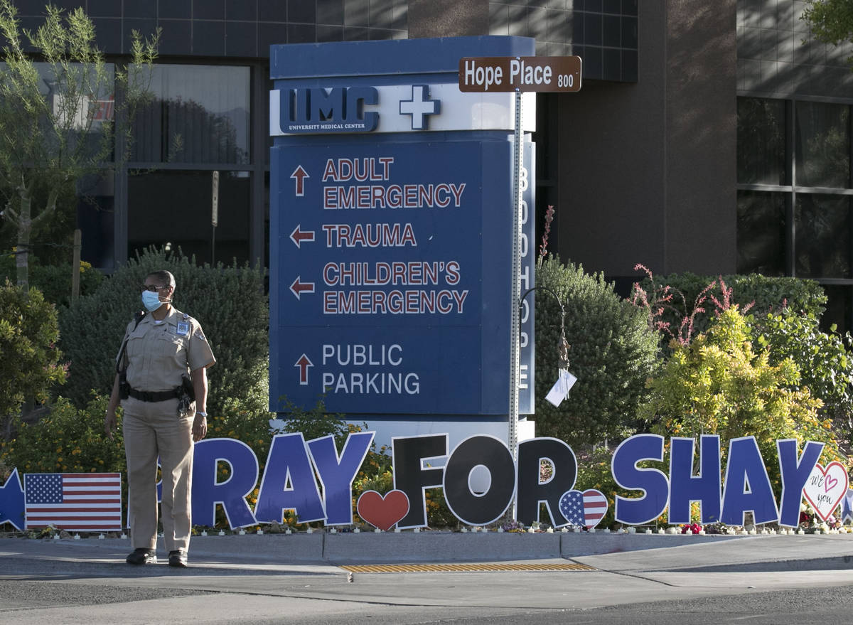 A University Medical Center (UMC) police officer stand guard outside the hospital during A &quo ...