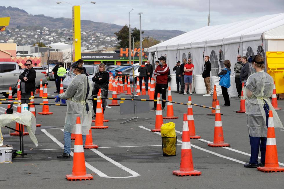 FILE - In this April 17, 2020, file photo, shoppers line up at a pop-up community COVID-19 test ...