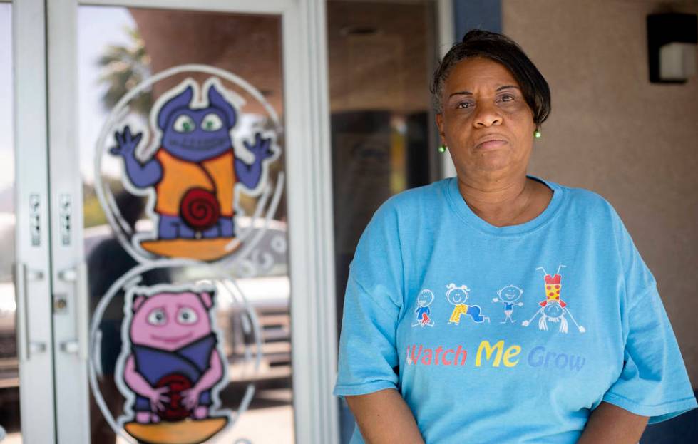 Kim Morgan-Smith stands in front of Watch Me Grow, the day care center where she works, on Frid ...