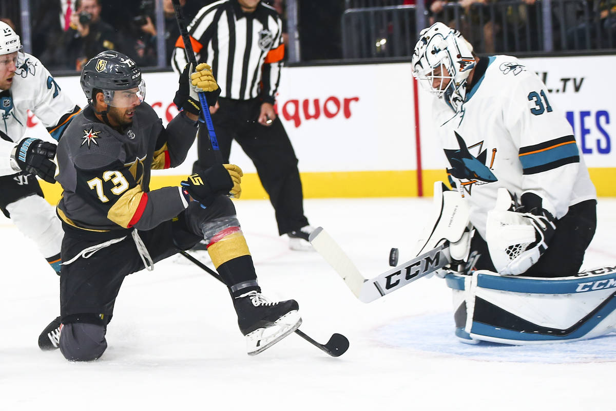 San Jose Sharks goaltender Martin Jones (31) blocks a shot from Golden Knights' Brandon Pirri ( ...