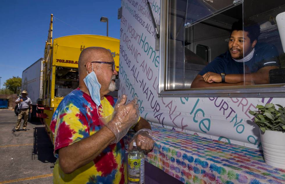 Gene Gunnels, left, of the Hot Diggity Dog Las Vegas and Jonathan Bradley of the Spoon-a-Bowl ...