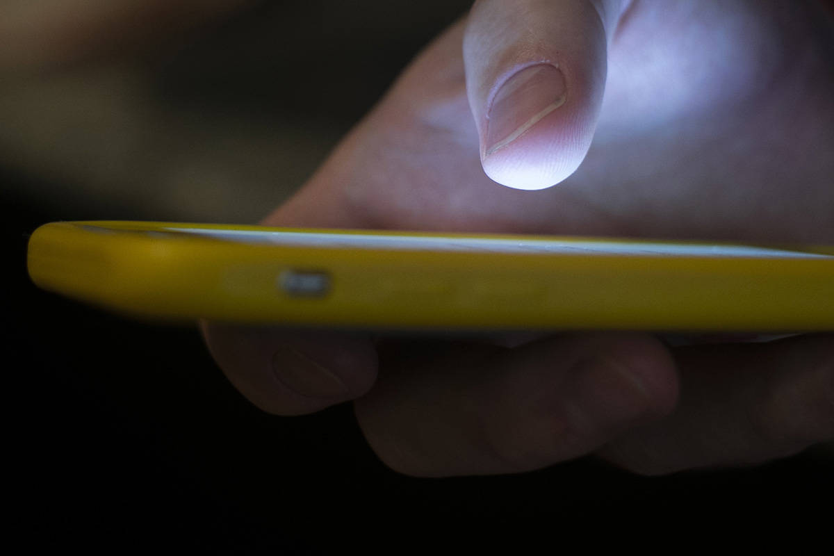 FILE - In this Aug. 11, 2019, file photo, a man uses a cell phone in New Orleans. The U.S. comm ...