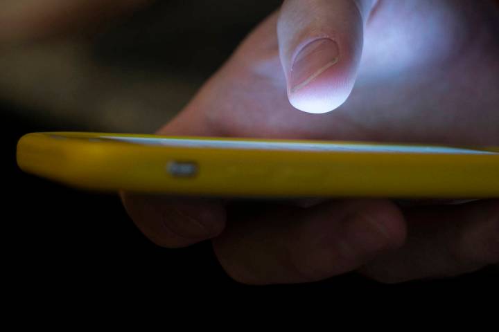 FILE - In this Aug. 11, 2019, file photo, a man uses a cell phone in New Orleans. The U.S. comm ...