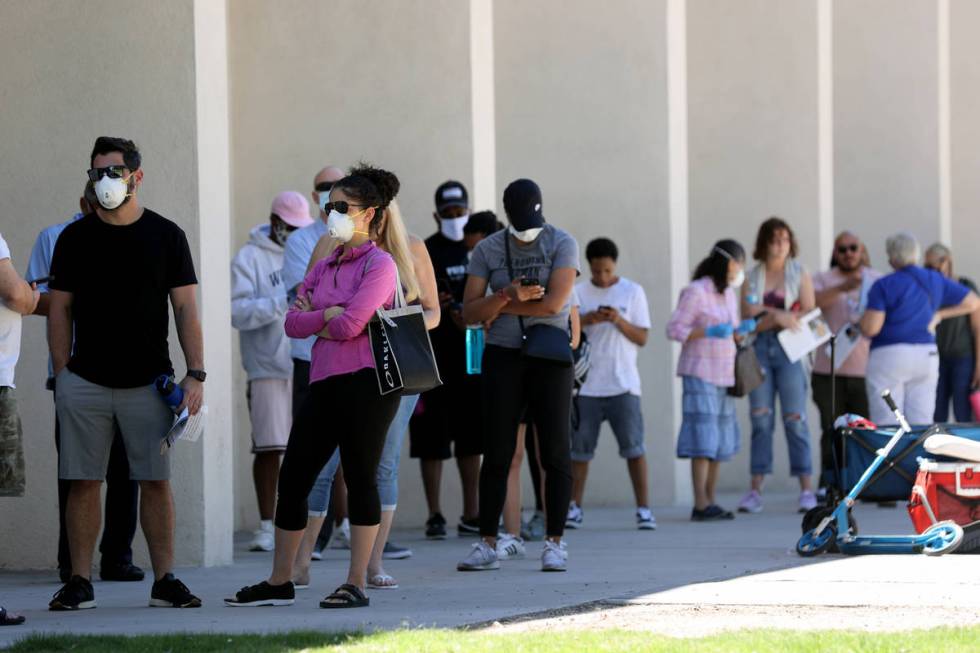 Voters who didn't receive a mailed ballot or need to make a change to their registration wait i ...