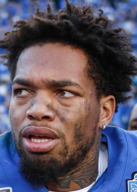 Kentucky quarterback Lynn Bowden Jr. stands on the field after leading his team to a 37-30 vict ...