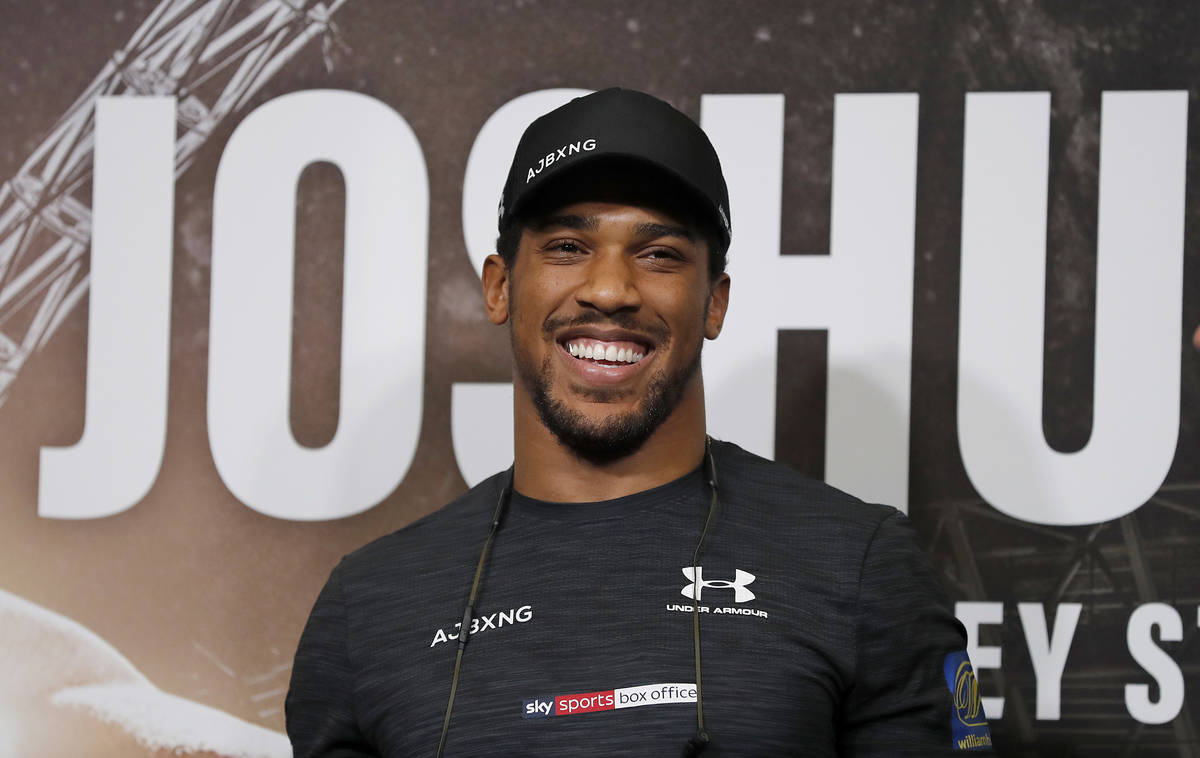 FILE - In this Sept. 20, 2018, file photo, Britain's Anthony Joshua smiles during a press confe ...