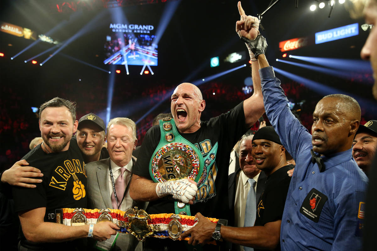 Tyson Fury celebrates technical knockout win against Deontay Wilder in round 7 of the WBC world ...