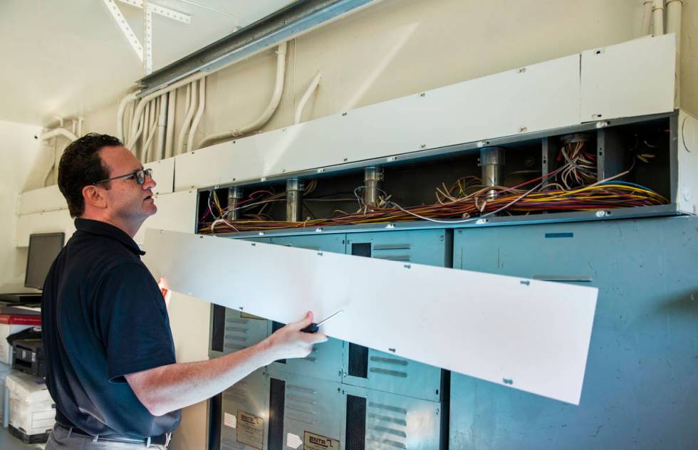Owner Jim Morgan shows off some of the extensive wiring used for casino monitoring during a tou ...