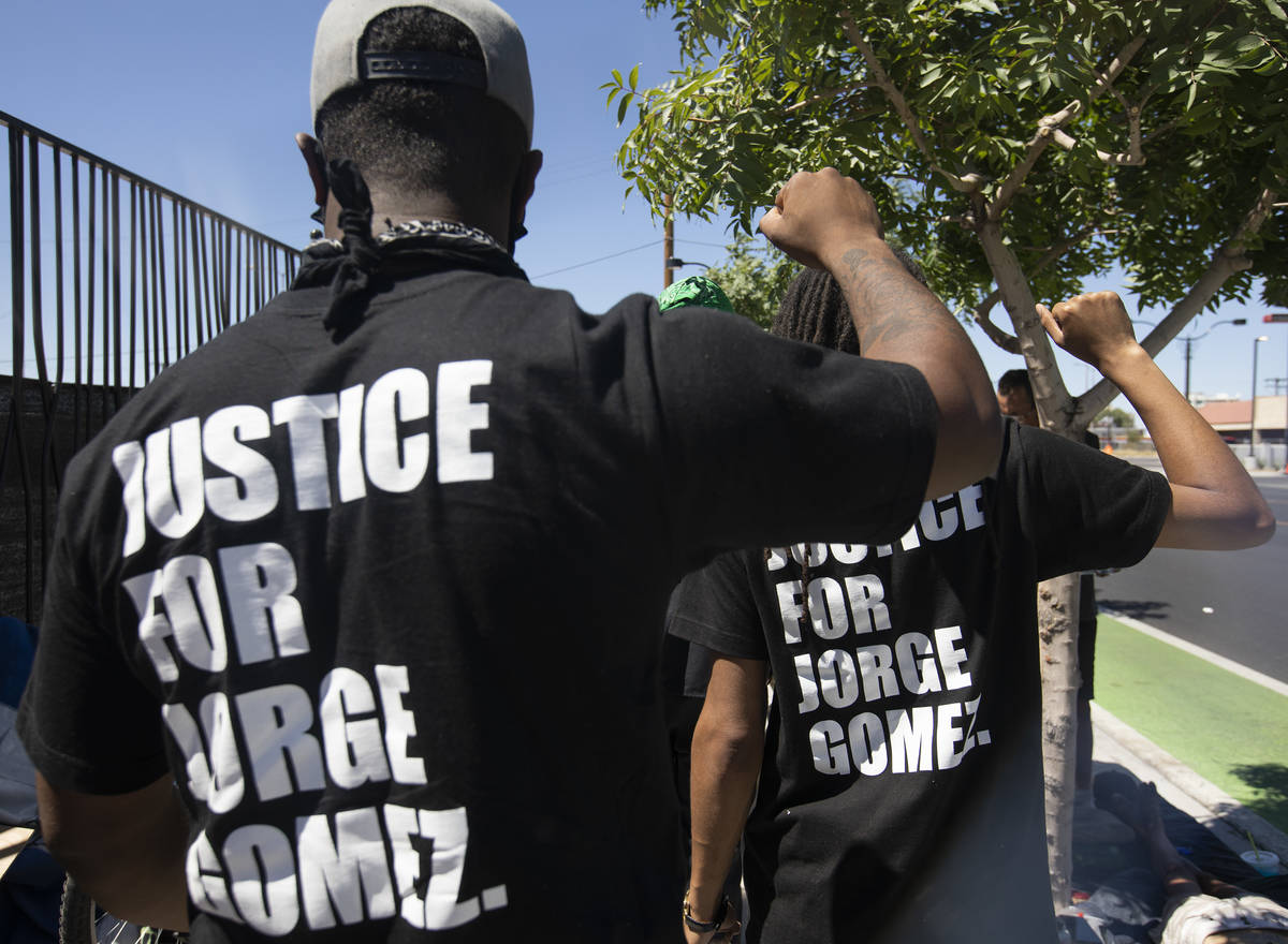 Deonte Thurman, left, and Dre Thurman, right, wear shirts saying "Justice for Jorge Gomez, ...