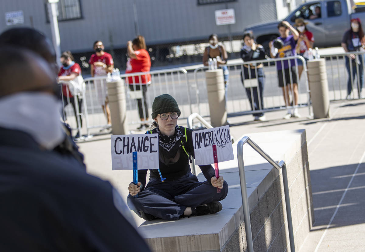 Erica Sommerfeld of Las Vegas sits in an area that police blocked off in anticipation of protes ...