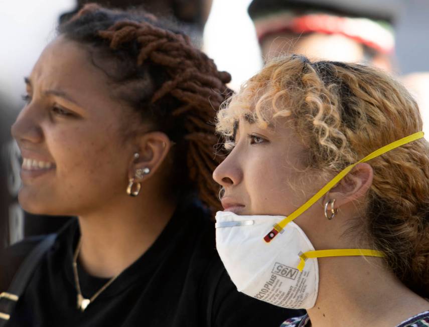 Jayla Scott, left, and Fernanda Rivera, right, get emotional while protesting in an effort to d ...