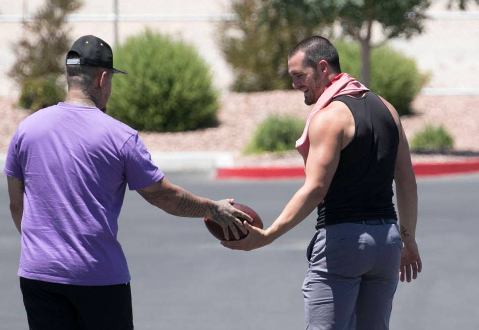 The Las Vegas Raiders quarterback Derek Carr, right, is seen after an unofficial practice on We ...