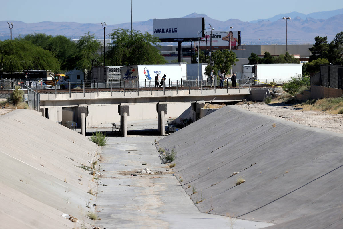 North Las Vegas Police investigate a shooting on railroad tracks over the Las Vegas Wash near D ...