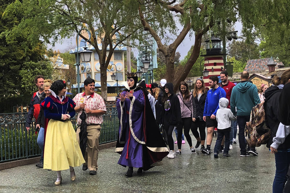 A visitor around at Disneyland in Anaheim, Calif. on Friday, March 13, 2020. Disneyland is clos ...