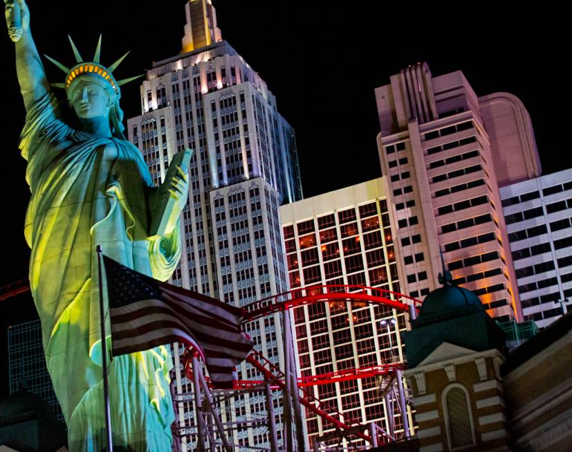 Lights through room windows are displayed at the New York-New York along the Las Vegas Strip on ...