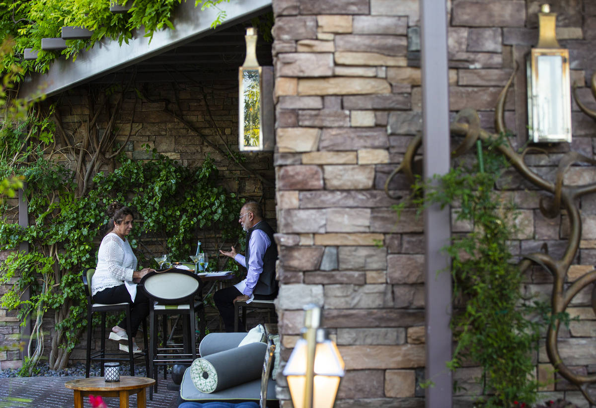 People dine outdoors at Vintner Grill in Las Vegas on Wednesday, June 10, 2020. (Chase Stevens/ ...