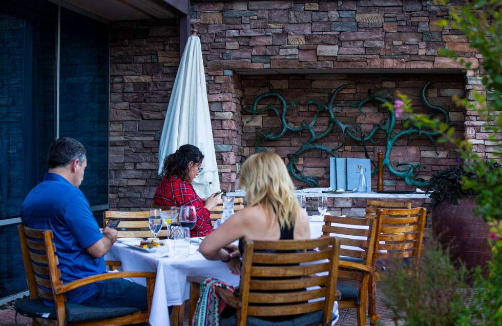 People dine outdoors at Vintner Grill in Las Vegas on Wednesday, June 10, 2020. (Chase Stevens/ ...