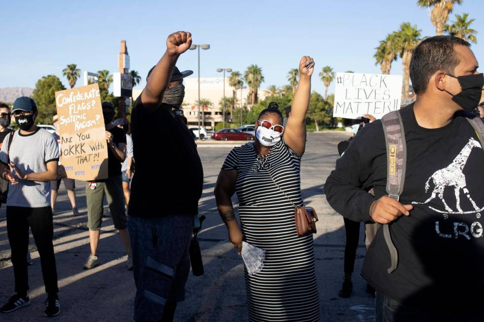 Married couple Kevin Johnson, left, and Angel Johnson, right, both born and raised Las Vegans, ...