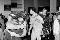 Los Angeles Raiders tight end Todd Christensen gives a big hug to friend Dorie Campbell as team ...