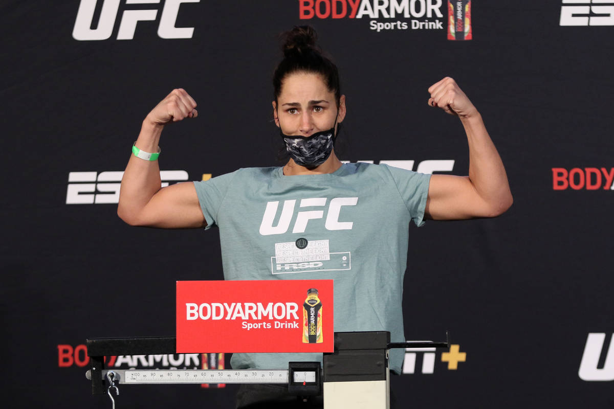 UFC flyweight Jessica Eye poses on the scale at the UFC Apex after weighing in for UFC on ESPN ...