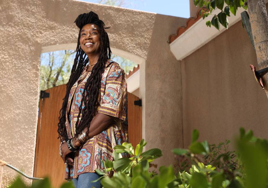 Erica Vital-Lazare, a college professor and artist, poses for a photo holding at her home in La ...