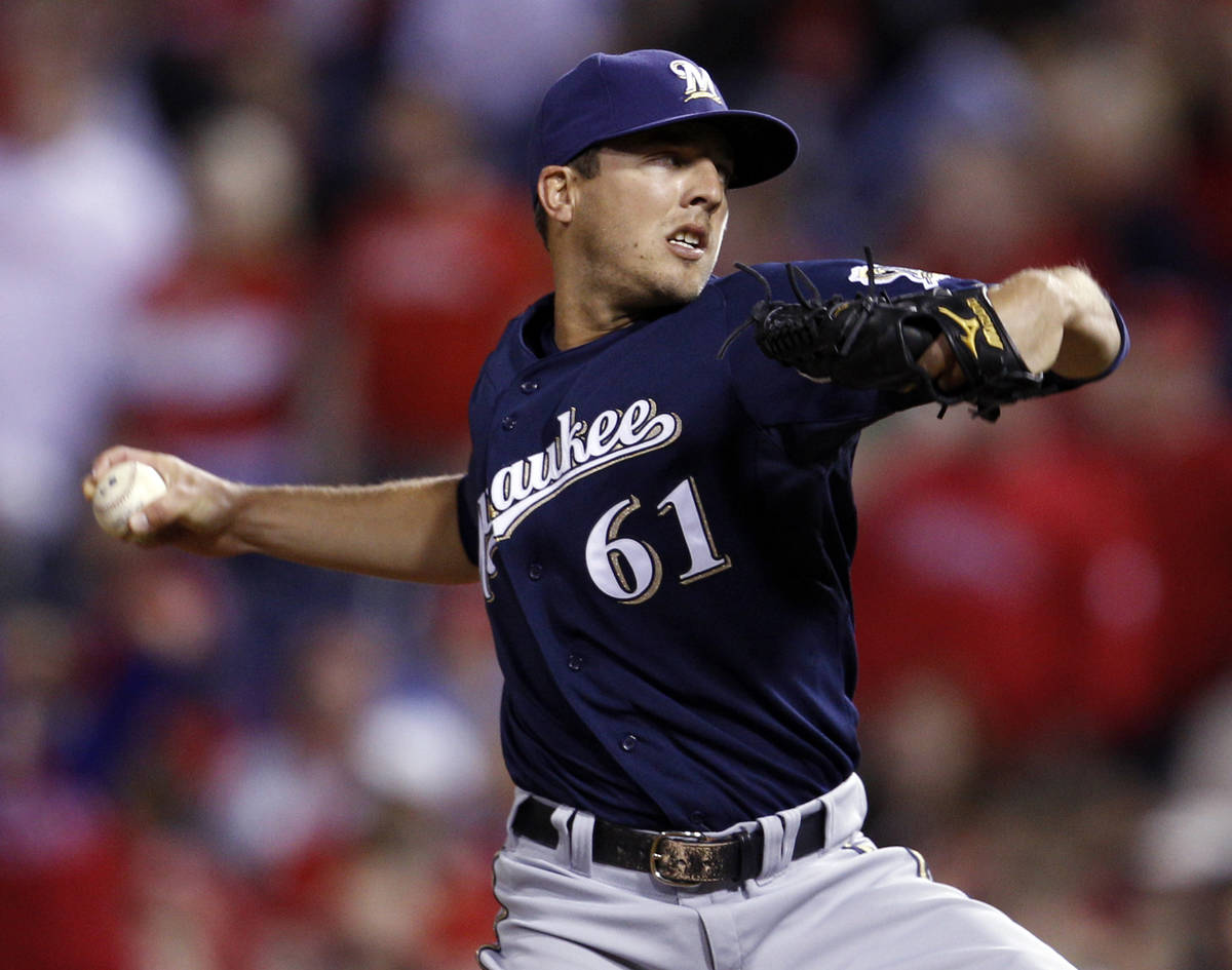 Milwaukee Brewers relief pitcher Brandon Kintzler throws during the 11th inning of a baseball g ...