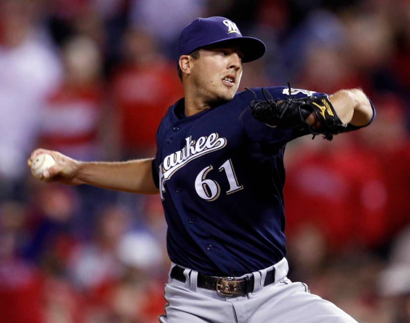 Milwaukee Brewers relief pitcher Brandon Kintzler throws during the 11th inning of a baseball g ...