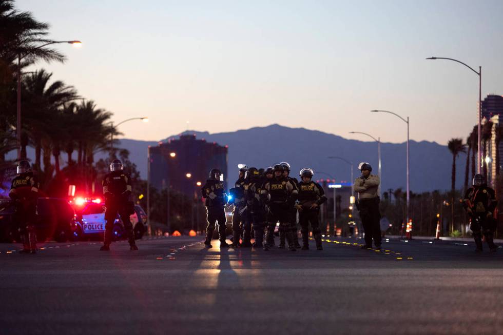 As the last protesters remain, police occupy the intersection of Polaris Avenue and West Russel ...