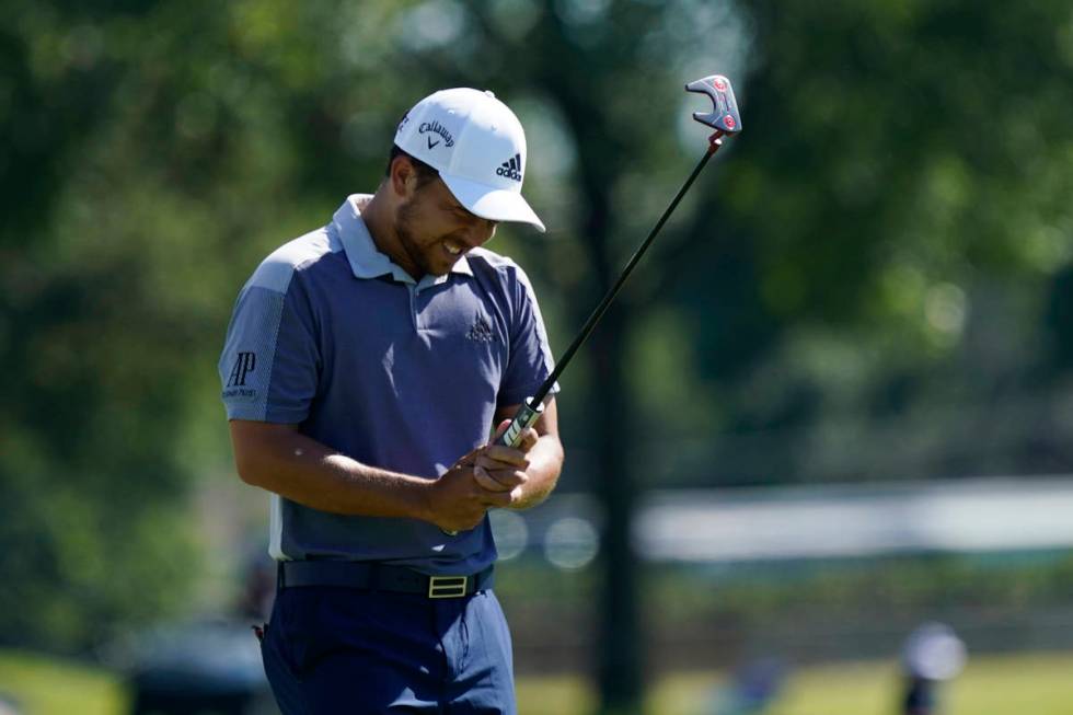 Xander Schauffele reacts after missing a birdie putt on the 18th green during the final round o ...