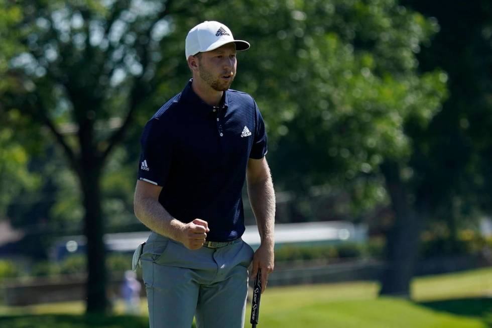 Daniel Berger pumps his fist after a birdie putt on the 18th hole during the final round of the ...