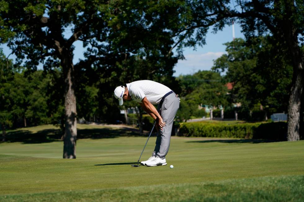 Coilin Morikawa misses a putt on the 17th green during a playoff round at the Charles Schwab Ch ...